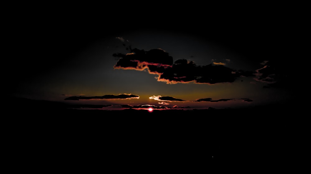 silhouette of clouds during sunset