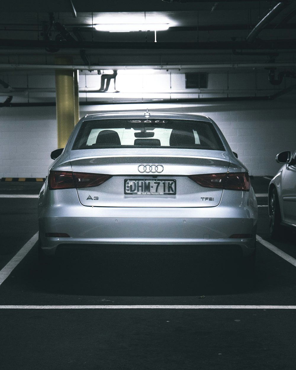 white bmw m 3 parked in parking lot