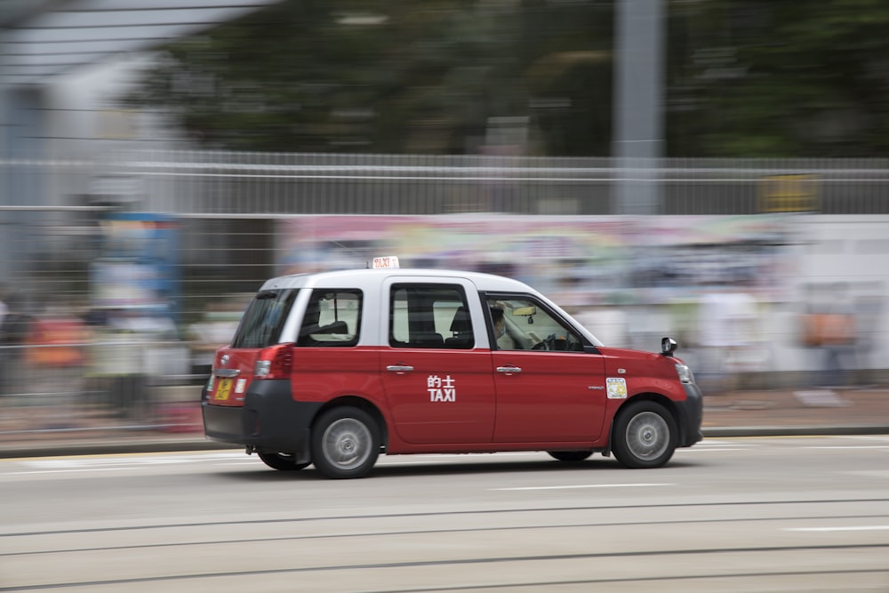 red and white van on road during daytime