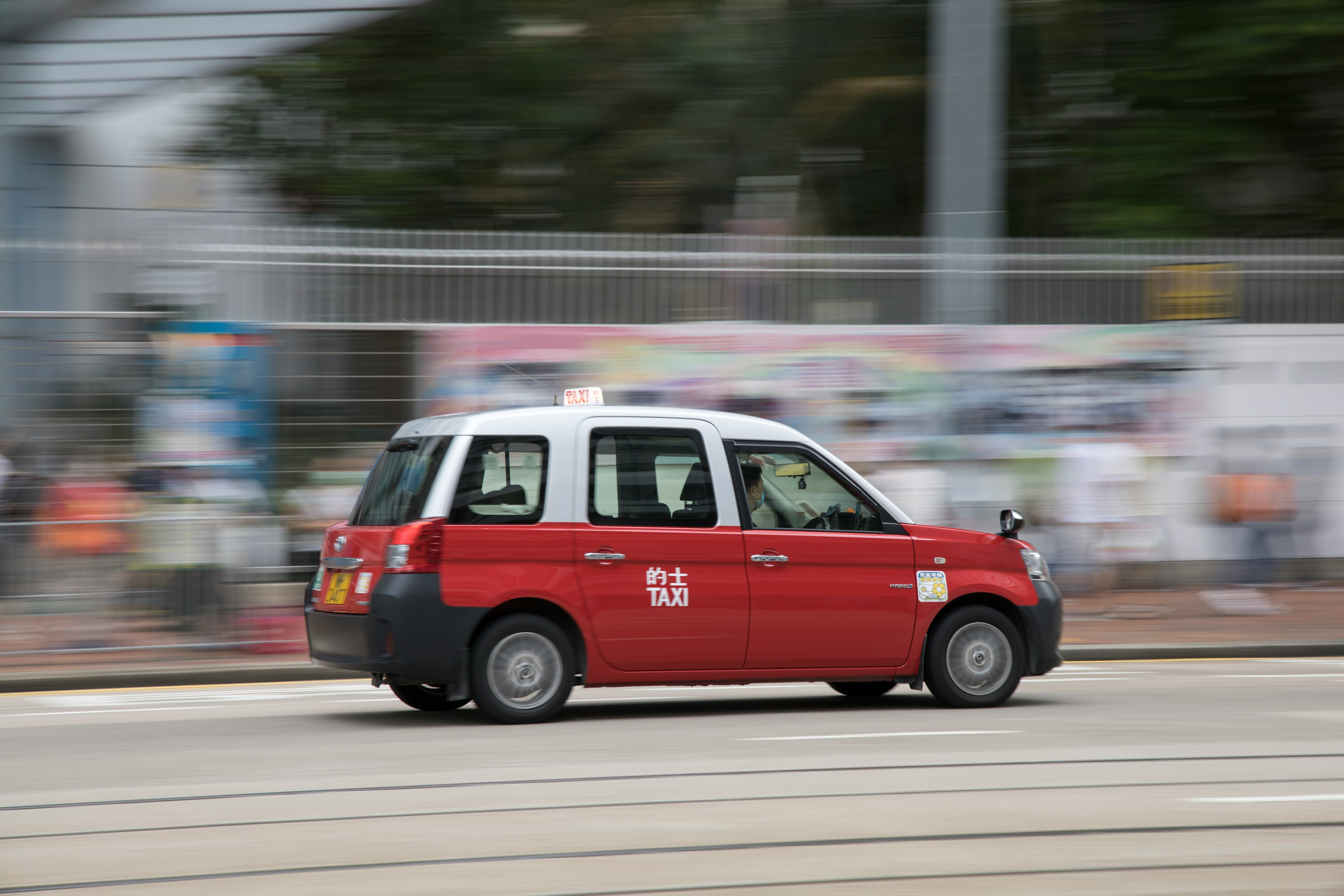 red and white van on road during daytime