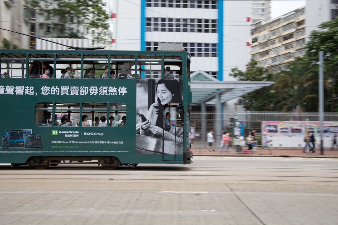 green and white train on track during daytime