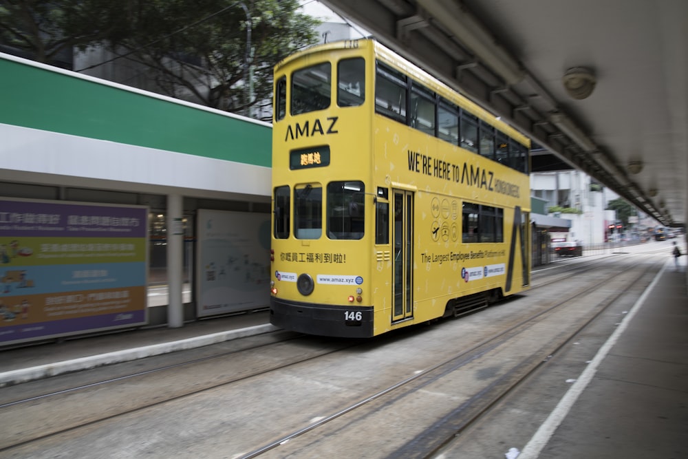 yellow and white tram on road during daytime