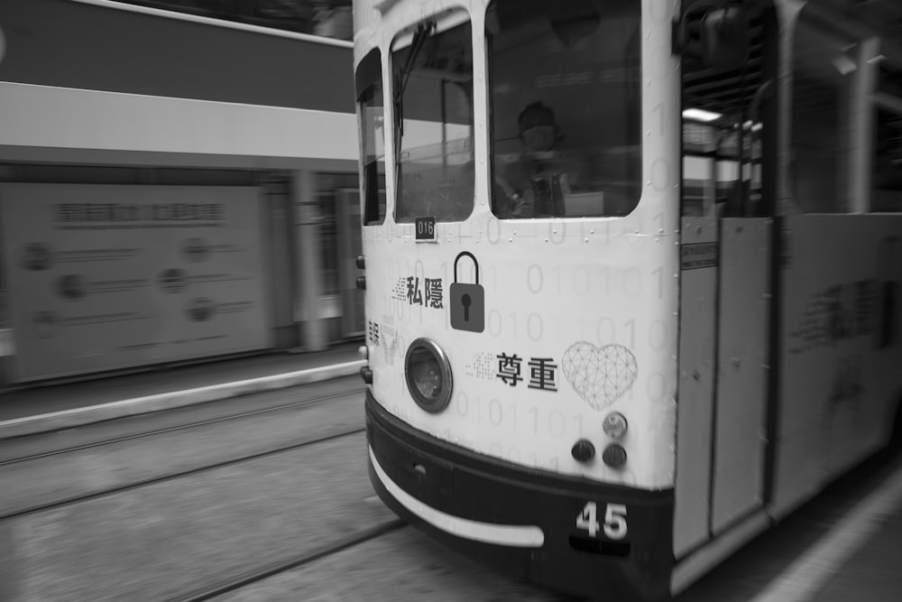 white and black train on train station