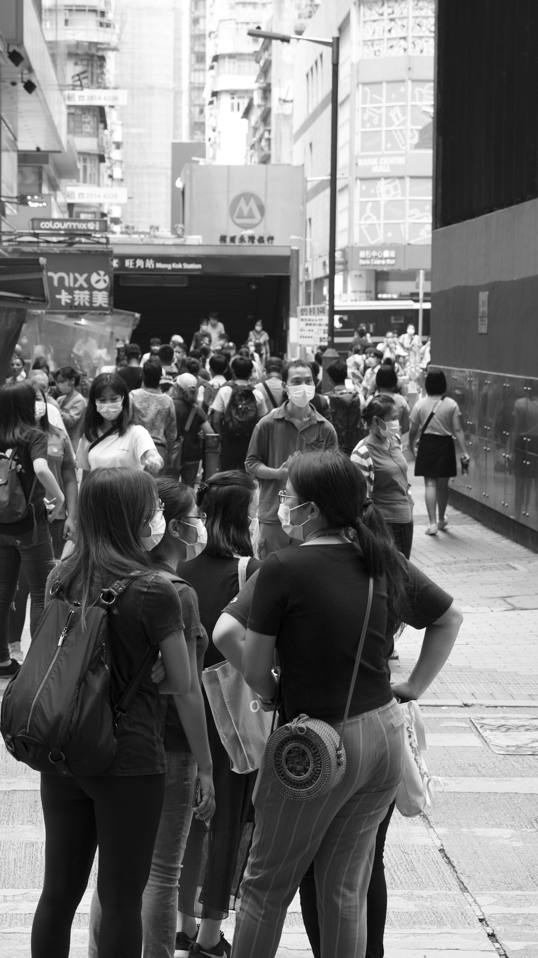 grayscale photo of people walking on street