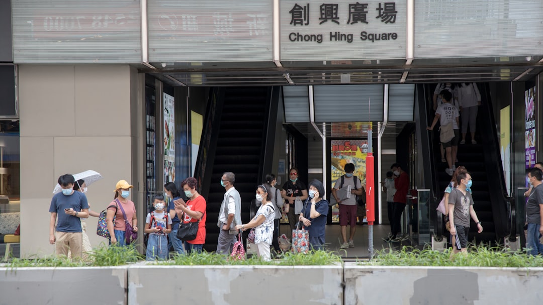 people standing in front of the building during daytime