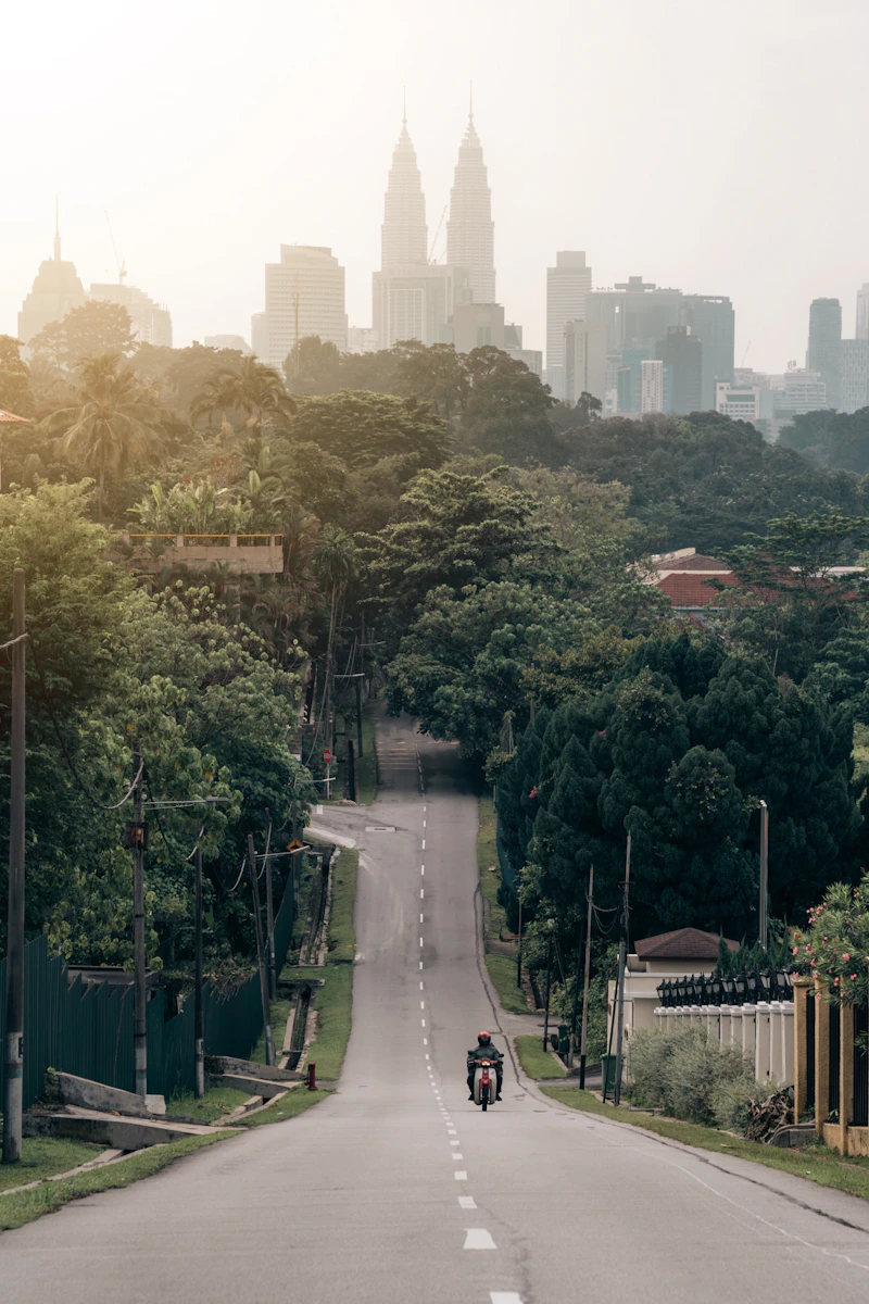 Green trees and city buildings in Malaysia