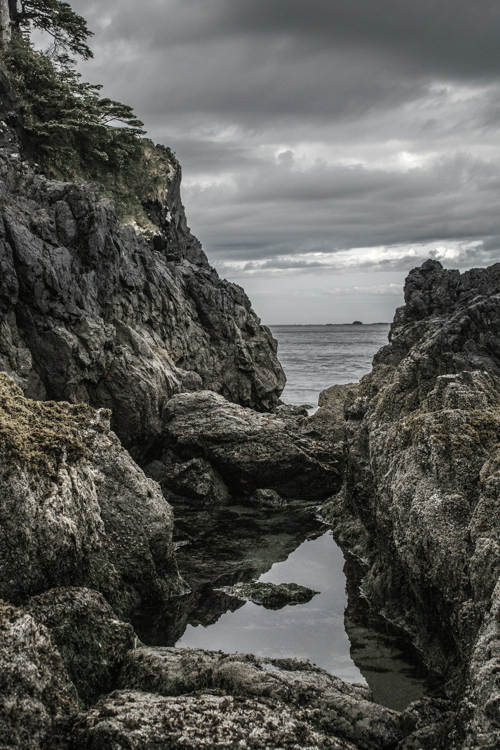 brown rock formation near body of water during daytime