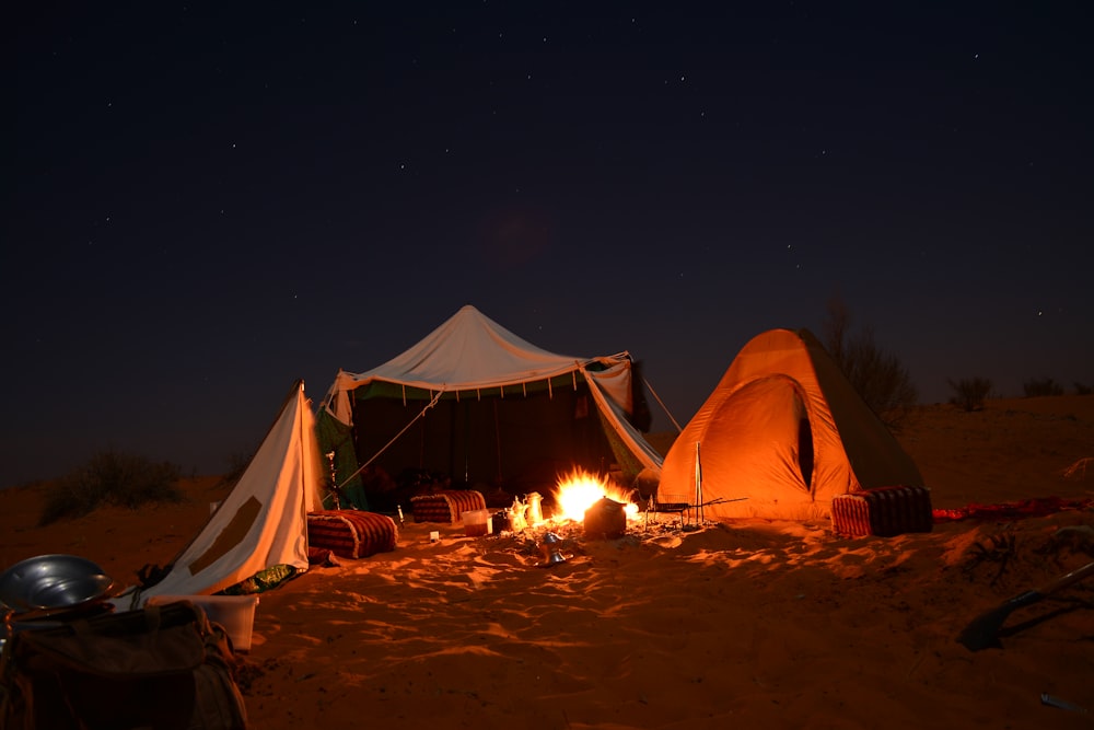 bonfire near tent under starry night