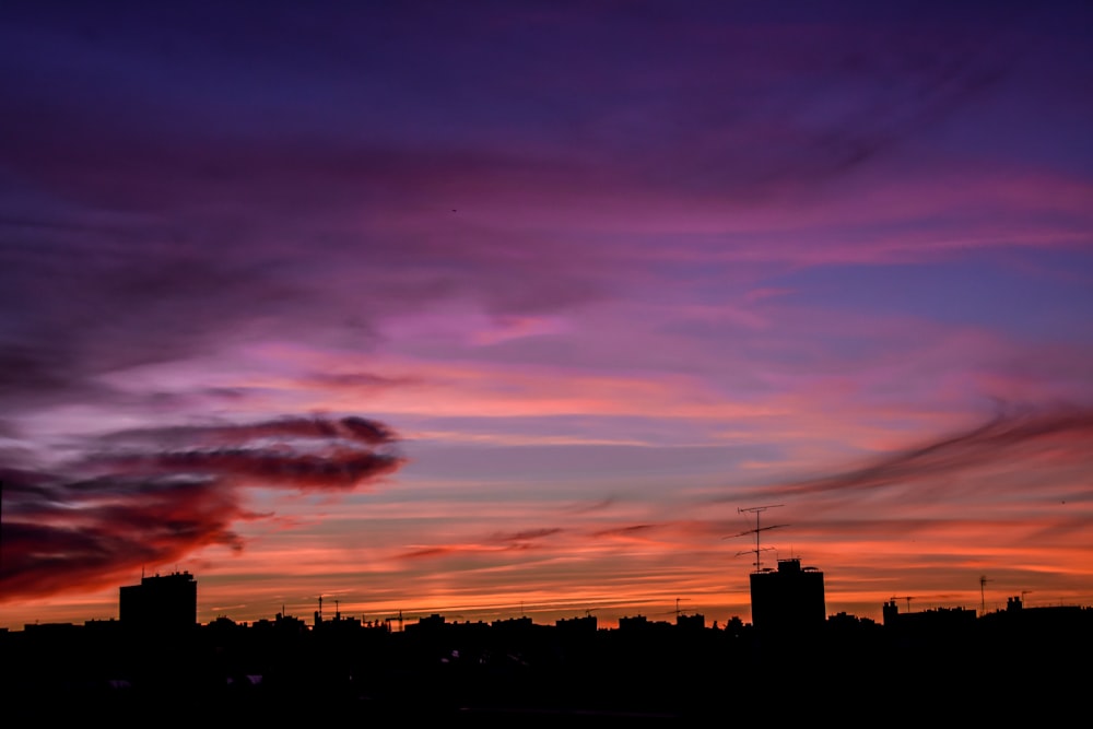 silhouette of building during sunset