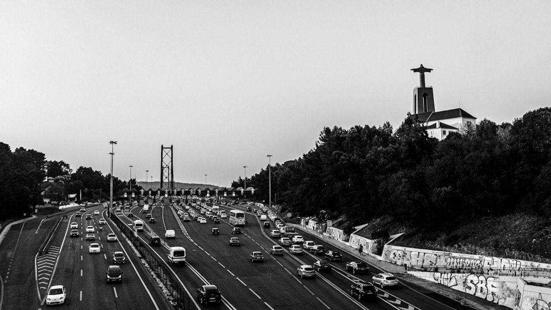 grayscale photo of cars on road