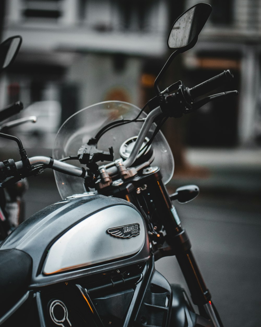 black and silver motorcycle on road during daytime