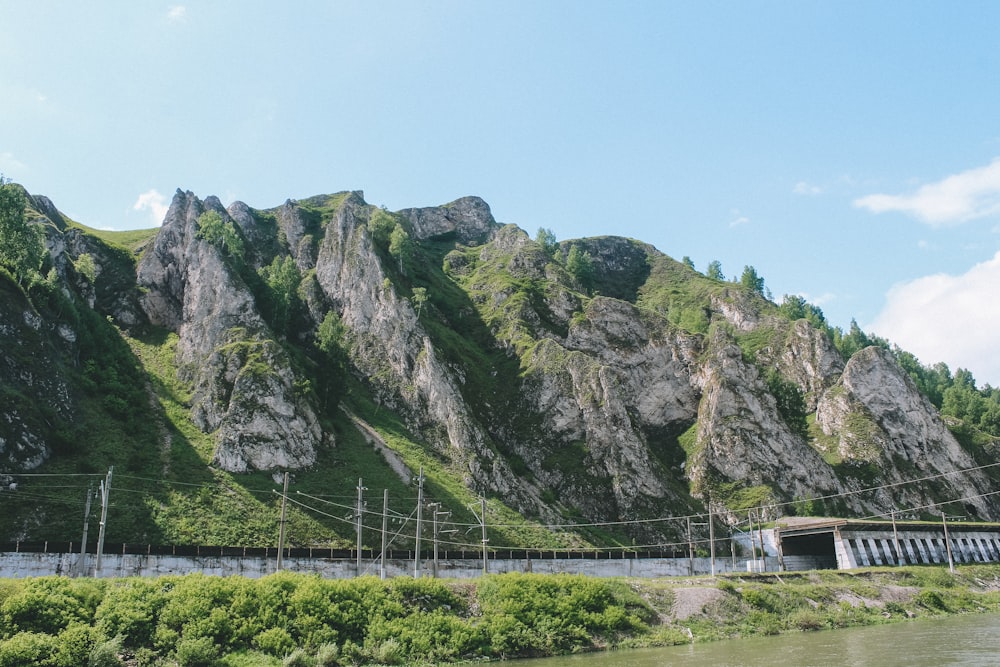 white bridge on mountain during daytime