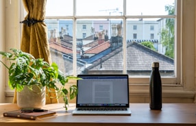 macbook air on brown wooden table