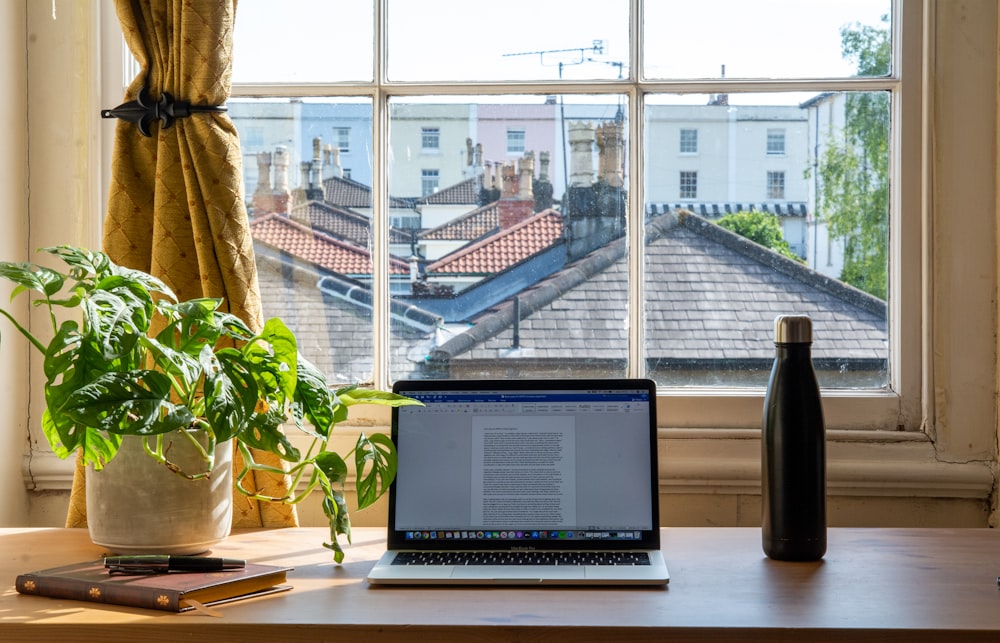 macbook air on brown wooden table