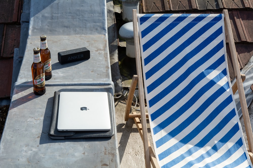 white and blue striped folding chair