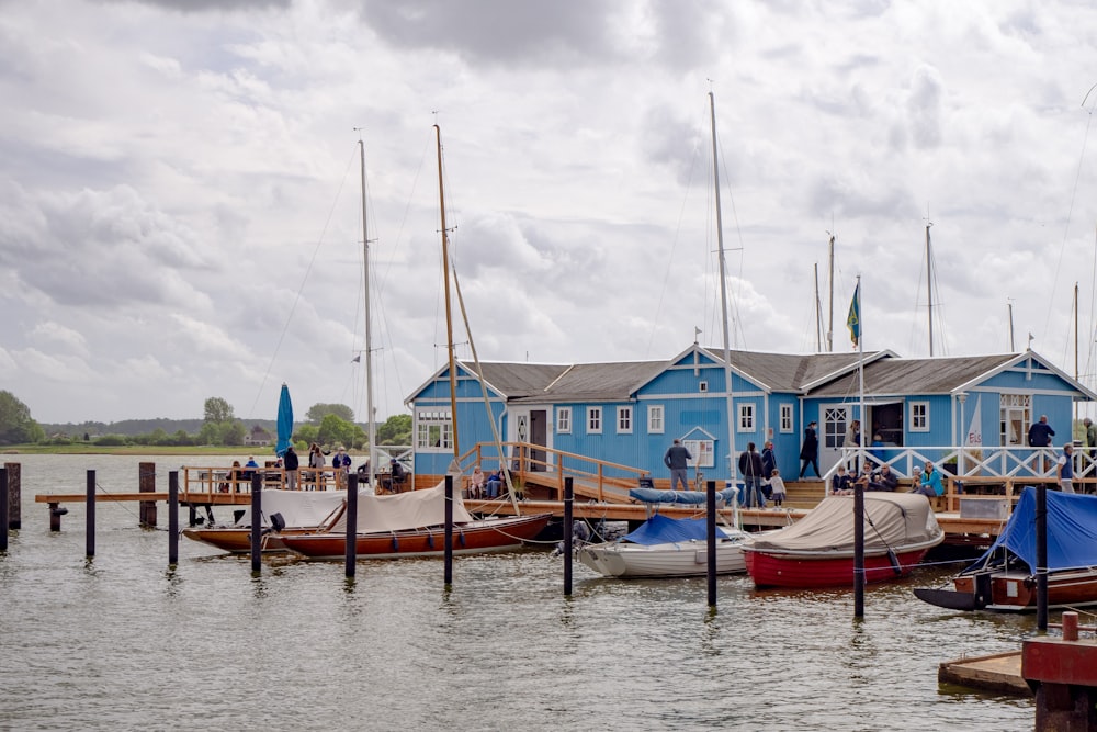 blue and brown boat on water during daytime