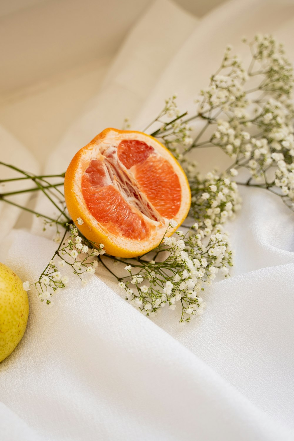 orange fruit on white textile