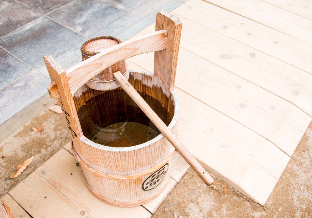  brown wooden bucket beside brown wooden chair bucket