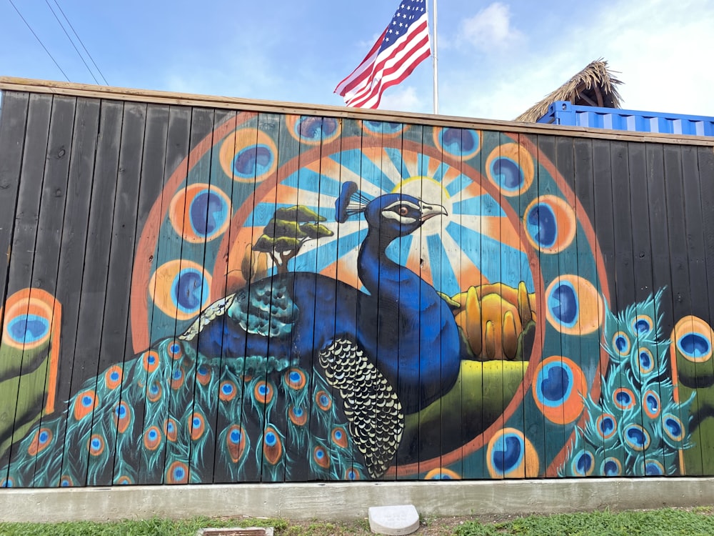 blue and black bird graffiti on wall