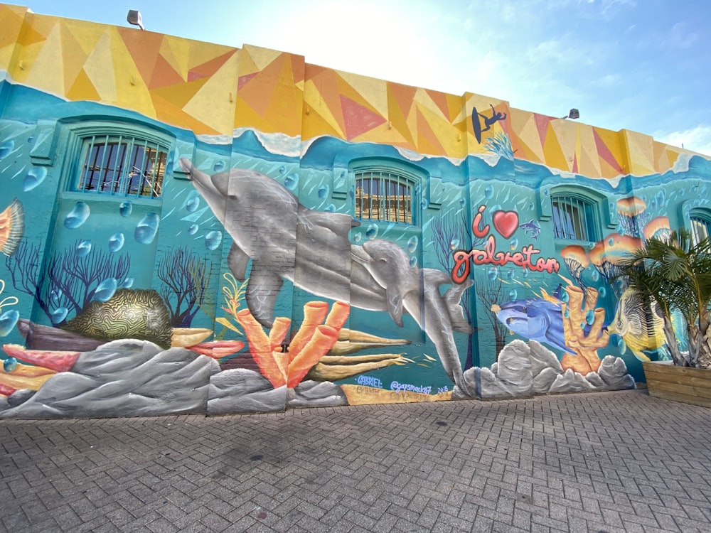 blue and brown graffiti on wall