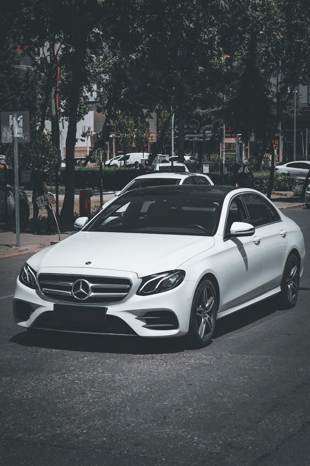 white mercedes benz coupe on road during night time