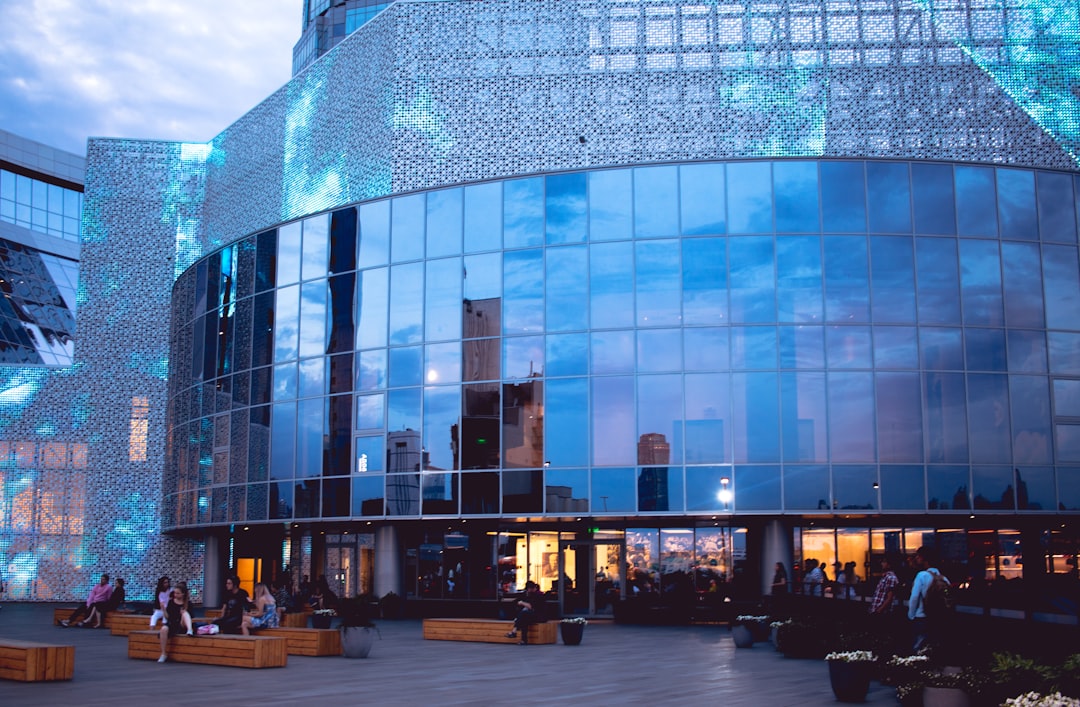 people walking near glass building during daytime