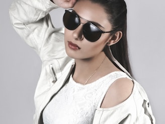 woman in white jacket wearing black sunglasses onlyfans