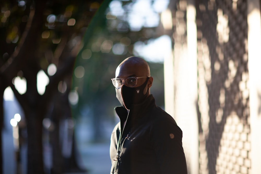 man in black jacket wearing sunglasses