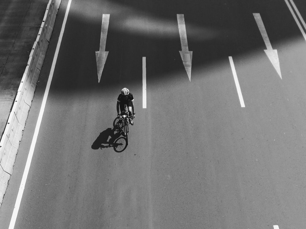 man in black jacket riding motorcycle on gray asphalt road during daytime