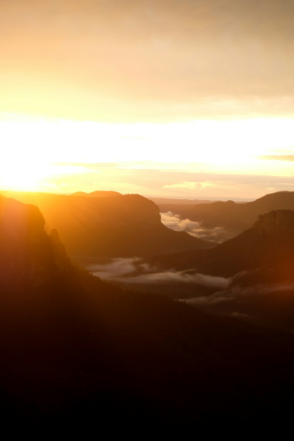 mountains covered with fog during daytime