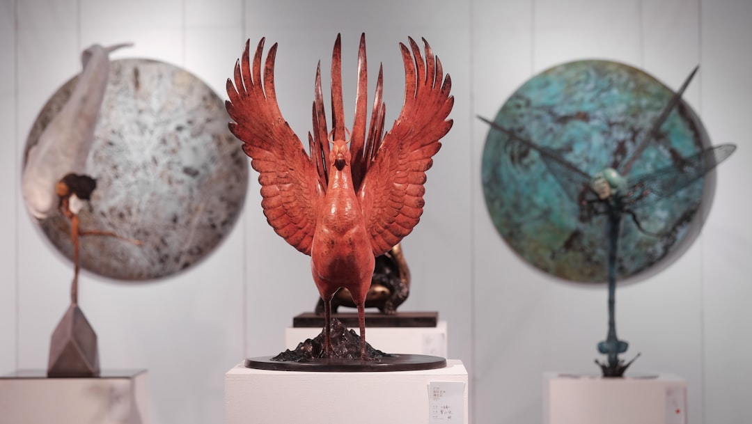 red and blue bird figurine