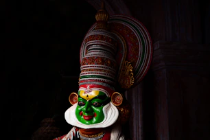 green and brown hindu deity figurine