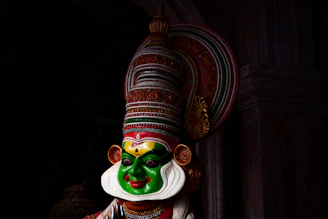 green and brown hindu deity figurine