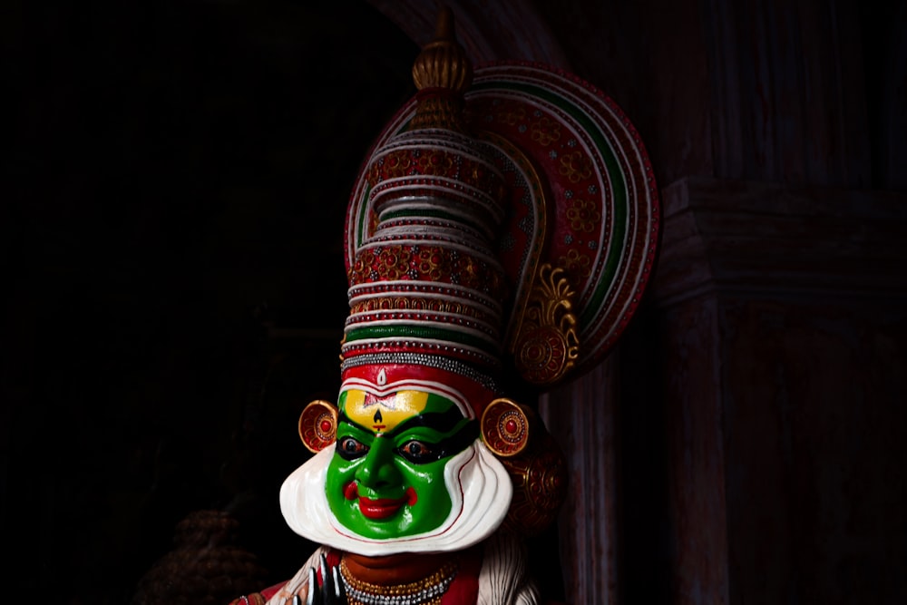 green and brown hindu deity figurine