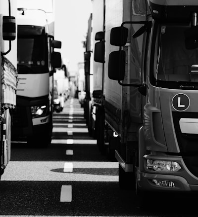 grayscale photo of cars on road