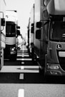 grayscale photo of cars on road