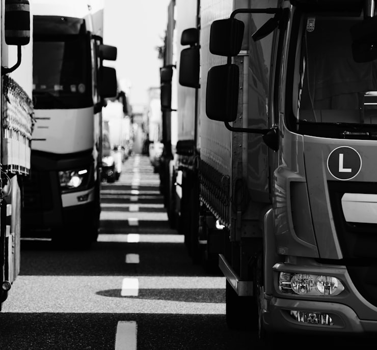 grayscale photo of cars on road