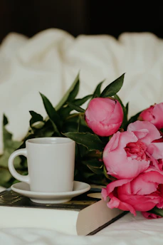 A cozy coffee cup surrounded by soft peach and lilac hues, symbolizing warm friendship.