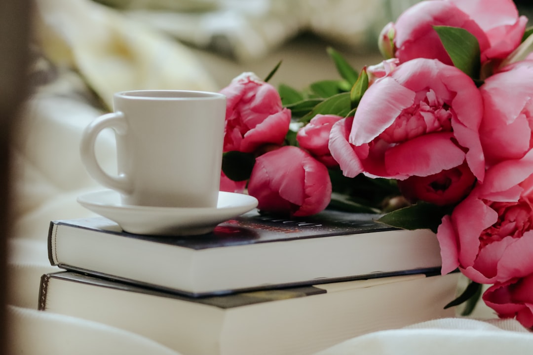 white ceramic mug on white ceramic plate