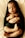 A peacefully sleeping baby wrapped in a dark green blanket. The baby is lying on its back with eyes closed and hands gently folded over its chest. The blanket partially covers the baby's body, and the background appears to be a soft, light-colored surface.