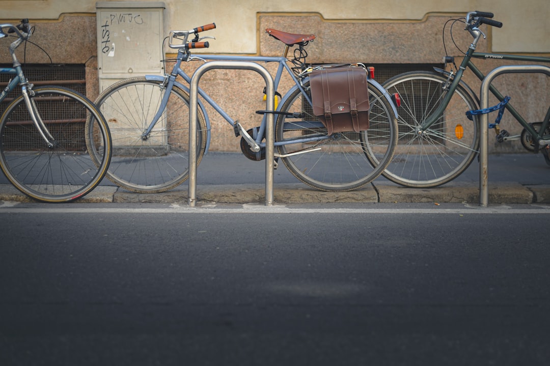 blue and silver city bicycle on road during daytime