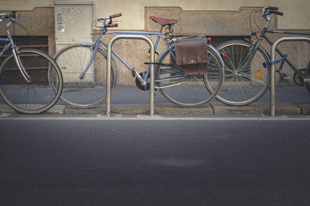 blue and silver city bicycle on road during daytime