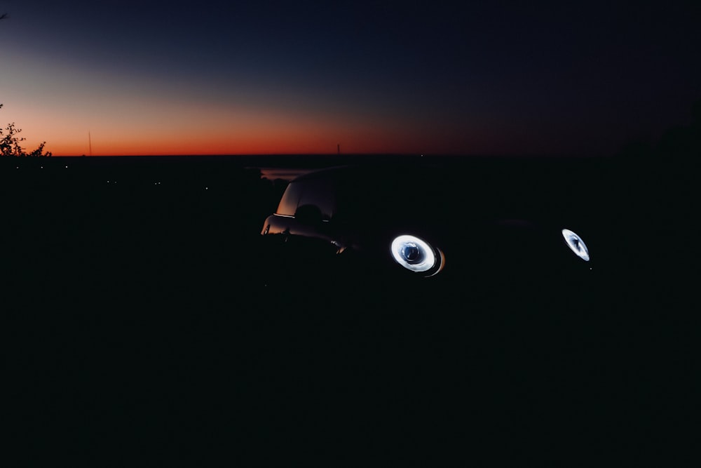 black car on the road during night time