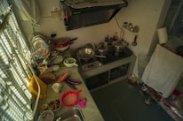 Before and after images showcasing a cleaned kitchen.