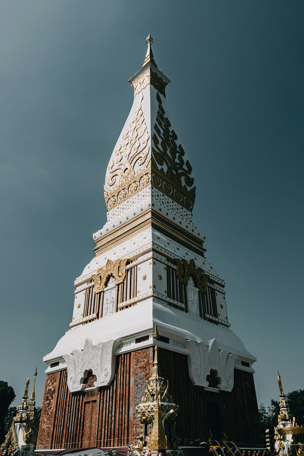 white concrete tower under blue sky