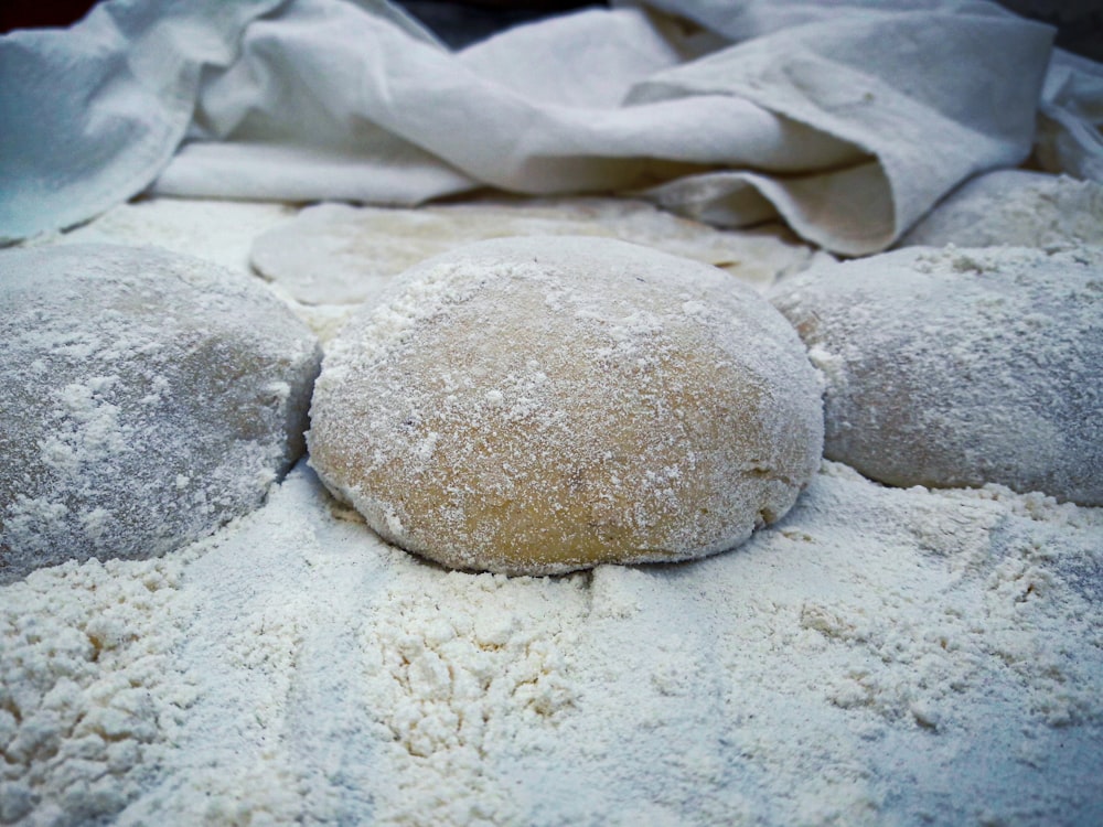 brown dough on white textile