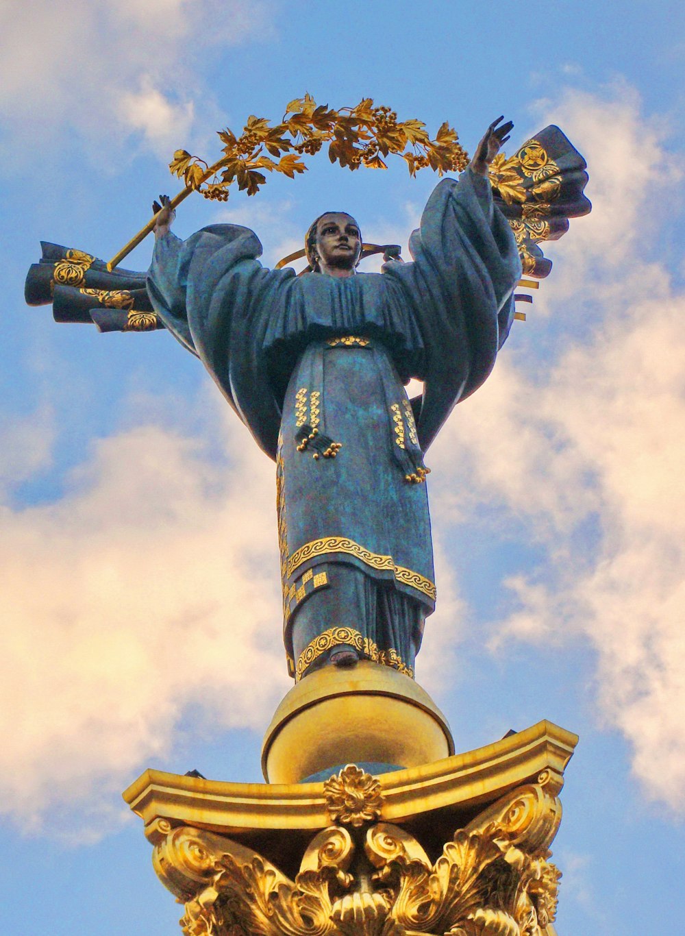 man holding a sword statue