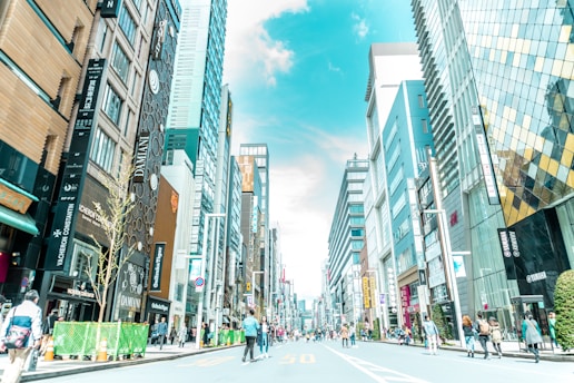 A bustling commercial district with vibrant storefronts and modern office spaces.