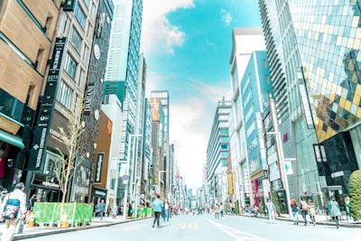 A bustling commercial property with storefronts and well-maintained sidewalks in a city center.