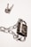 A padlock securely fastened with a chain, placed next to a set of keys on a white background. The metal surface of the padlock and chain reflects light, giving a shiny appearance.